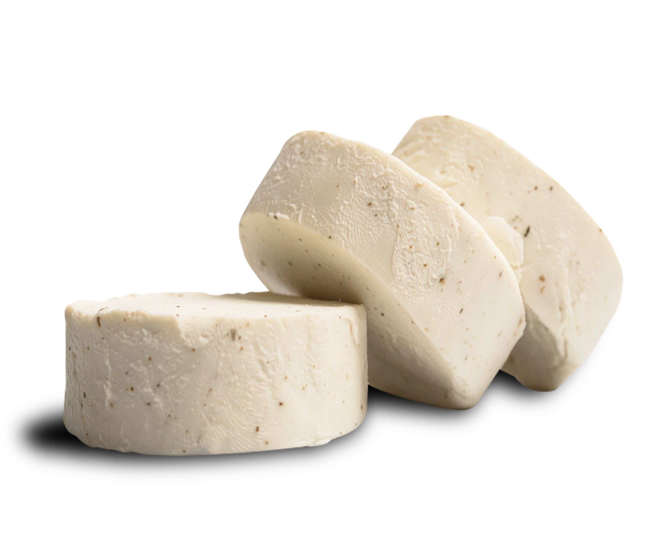 Medallones de queso de cabra Le Blanc a las finas hierbas, mostrando las especias integradas en su textura cremosa y el corte artesanal.
